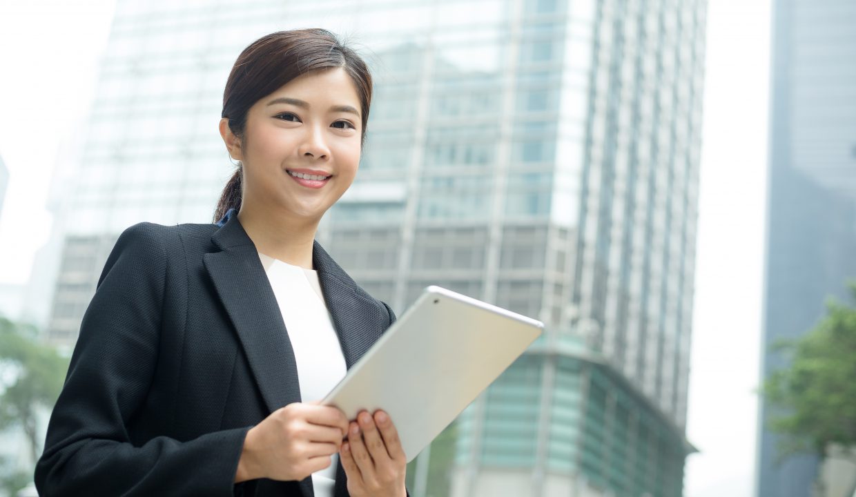 young business woman hold with tablet computer L75RAYG